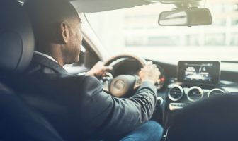 man driving car